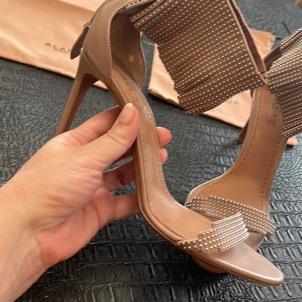 ALAIA Leather Sandals- Nude
Fringe & Studded Accents
Wrap-Around Straps 39 1/2